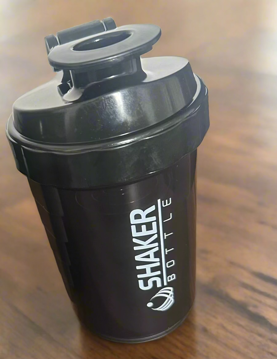 A black shaker bottle with black lid